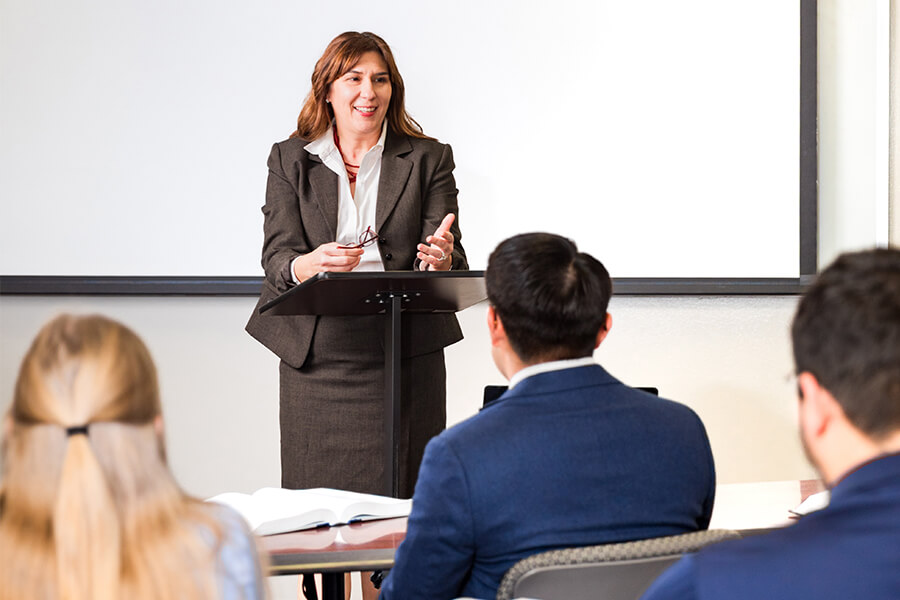 Ramona Lampley, J.D., Professor Law, teaches a course in a classroom in the Sarita Kenedy East Law Library.