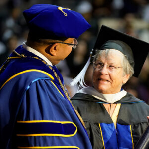 Patricia Howey, who is the first graduate to earn a Master of Jurisprudence with a concentration in Special Education Advocacy, accepts her degree on stage during Fall 2024 Law Commencement.