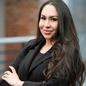Photo of Yuliana Gaytan Portillo, who will earn her J.D. in May 2025. She is dressed in a black jacket and blouse.