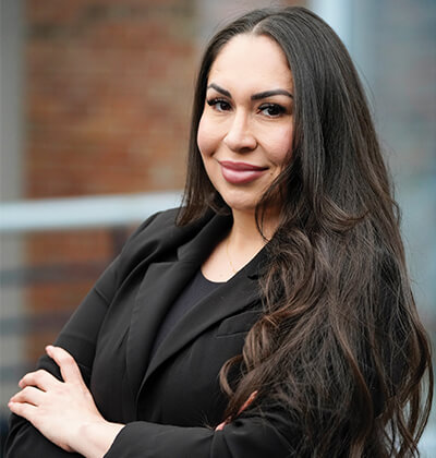 Photo of Yuliana Gaytan Portillo, who will earn her J.D. in May 2025. She is dressed in a black jacket and blouse.