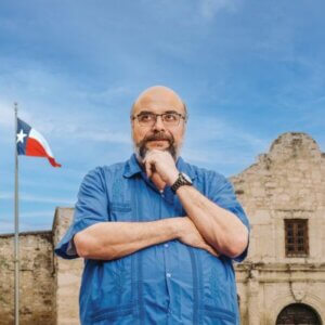 Ernesto Rodriguez III contemplates history outside the Alamo.