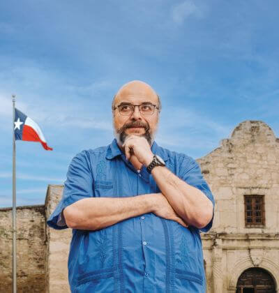 Ernesto Rodriguez III contemplates history outside the Alamo.