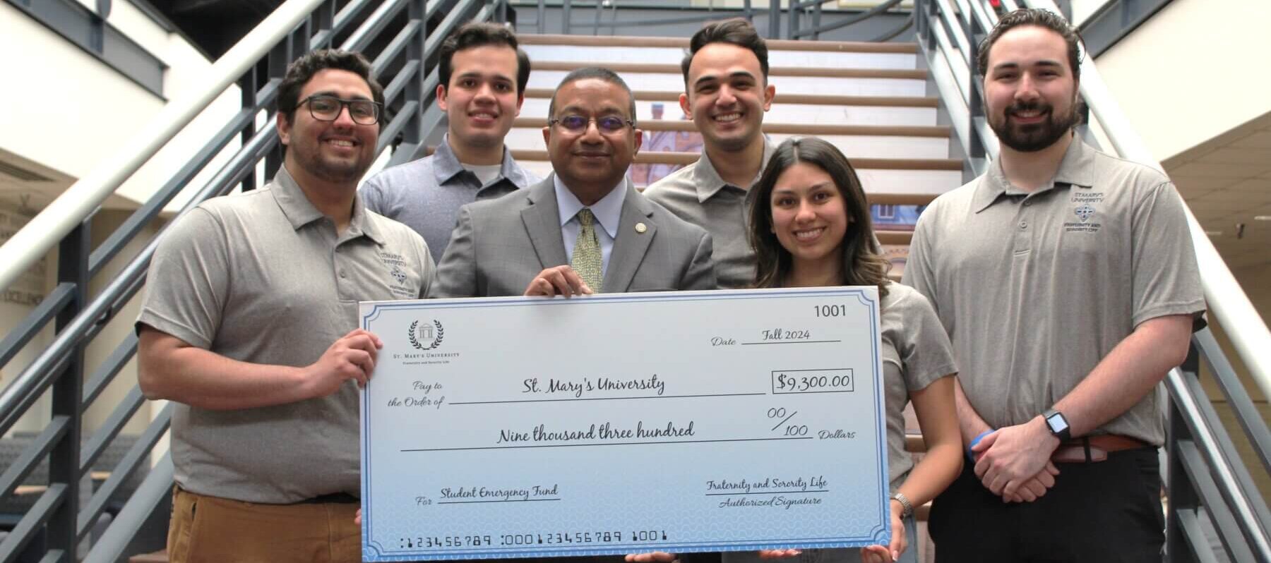 Giant check awarded to St. Mary's University for Student Emergency Funding
