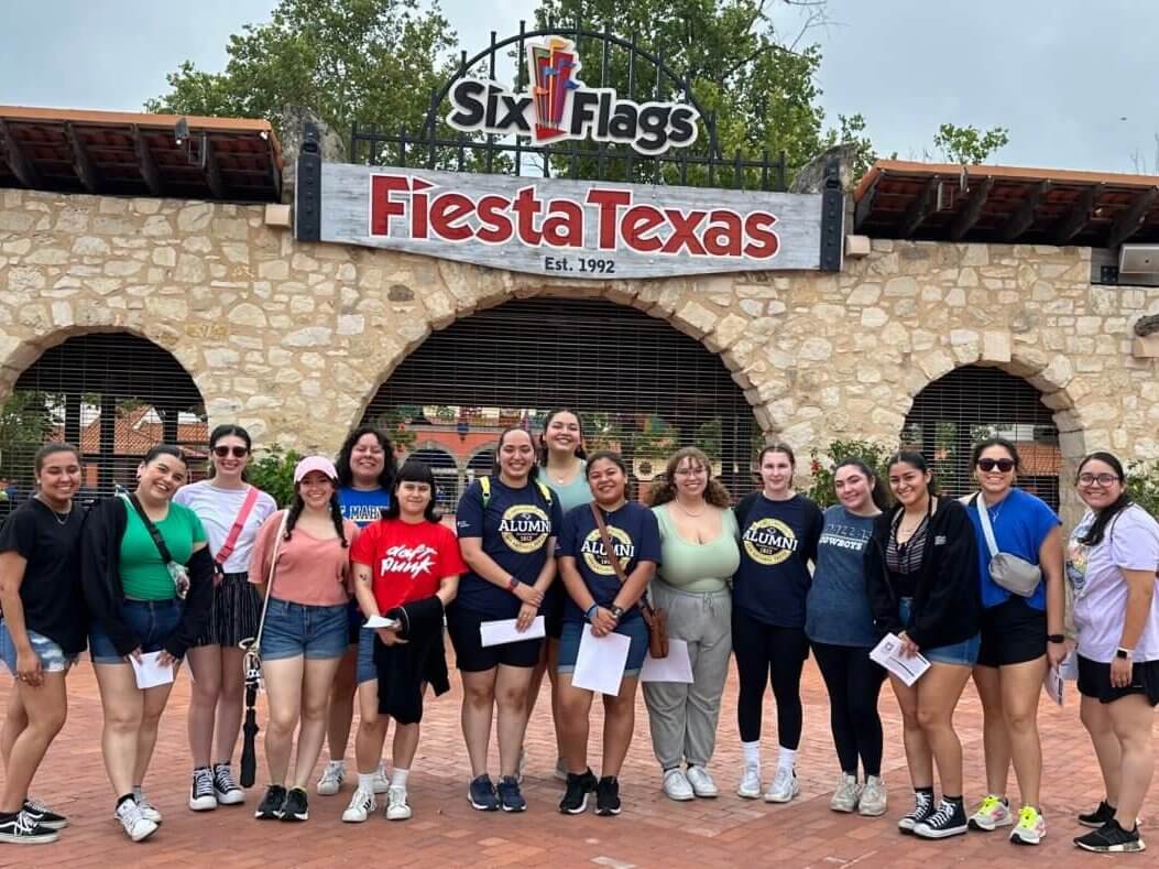 Students smile for a picture at Six Flags Fiesta Texas