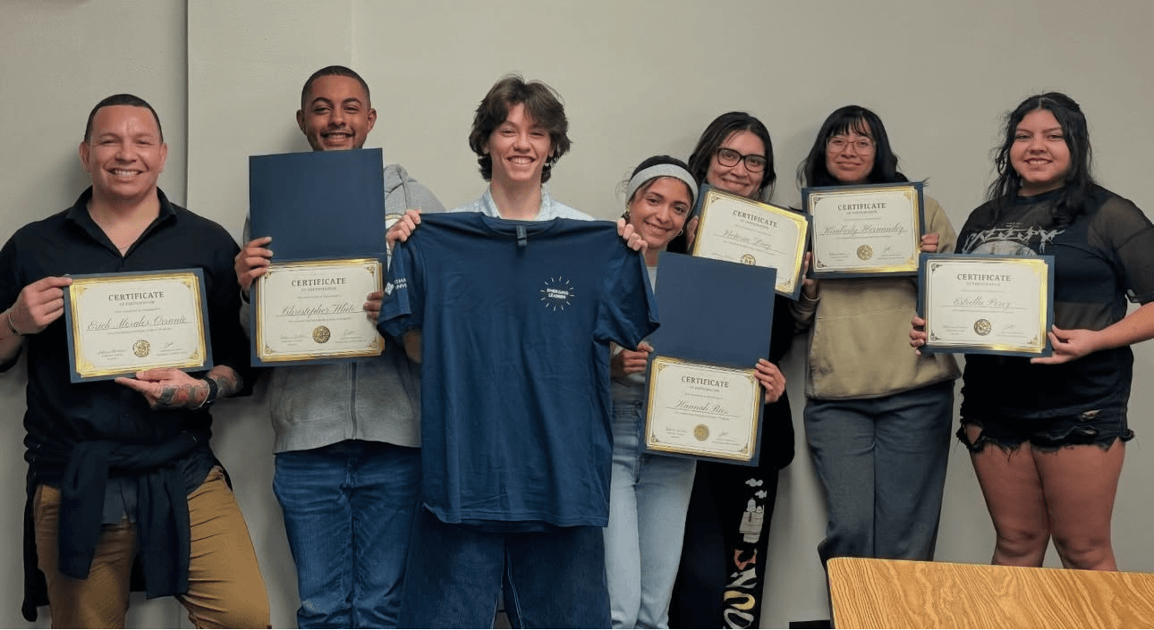 Leadership Program students receive an award and shirt
