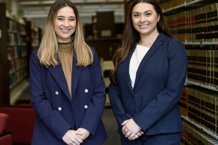 Photo of Caroline Villarreal and Kendall Michaelis in the Sarita Kenedy East Law Library on the St. Mary's Law campus.