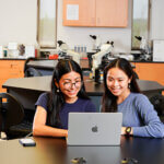Two students explore the new Master of Science Medical Genomics program online