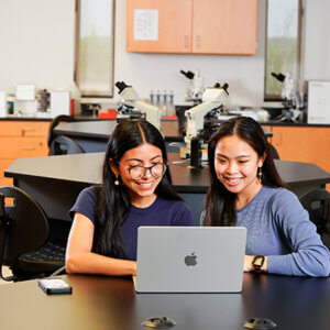 Two students explore the new Master of Science Medical Genomics program online