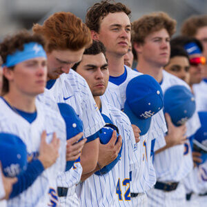 Rattler Men's Baseball hold their hands over their hearts during the national anthem