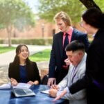 J.D. students chat in the Law Courtyard.