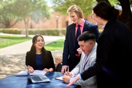 J.D. students chat in the Law Courtyard.