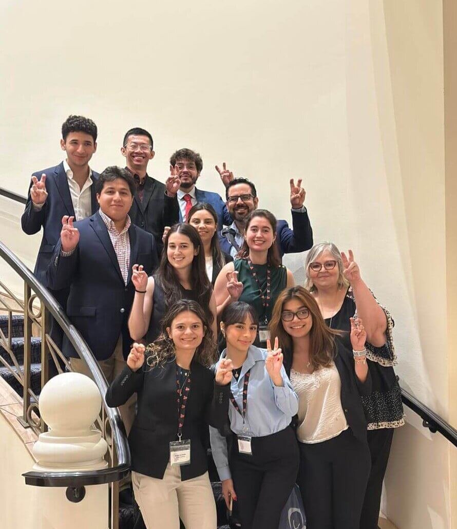 Group of students in Emerging Entrepreneurs Program standing on steps.