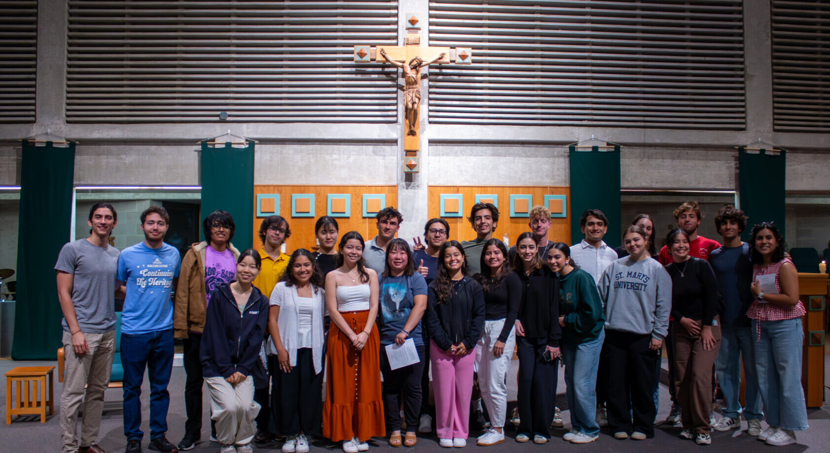 International students take a group photo in Guadalupe Chapel at St. Mary's University.