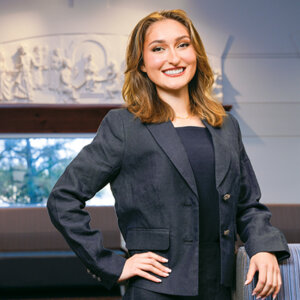 J.D. student Emily Trollinger is standing in the Law Commons in the Sarita Kenedy East Law Library on campus.