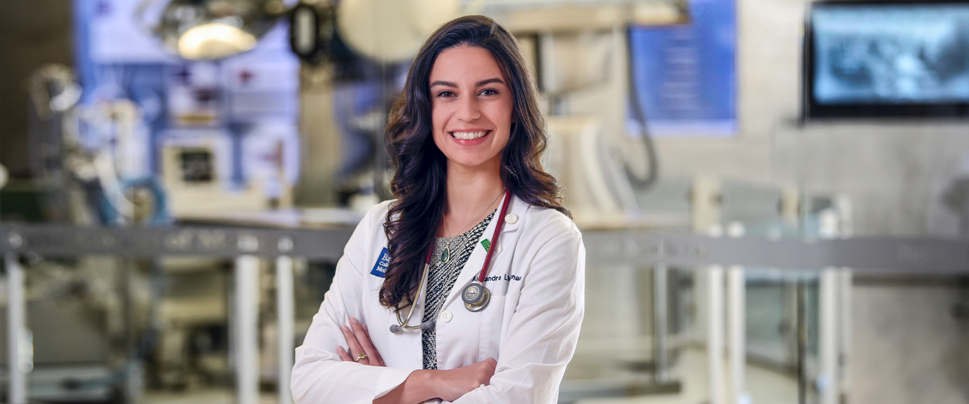 Alex McLennan stands in the DeBakey Library and Museum at the Baylor College of Medicine.