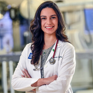 Alex McLennan stands in the DeBakey Library and Museum at the Baylor College of Medicine.