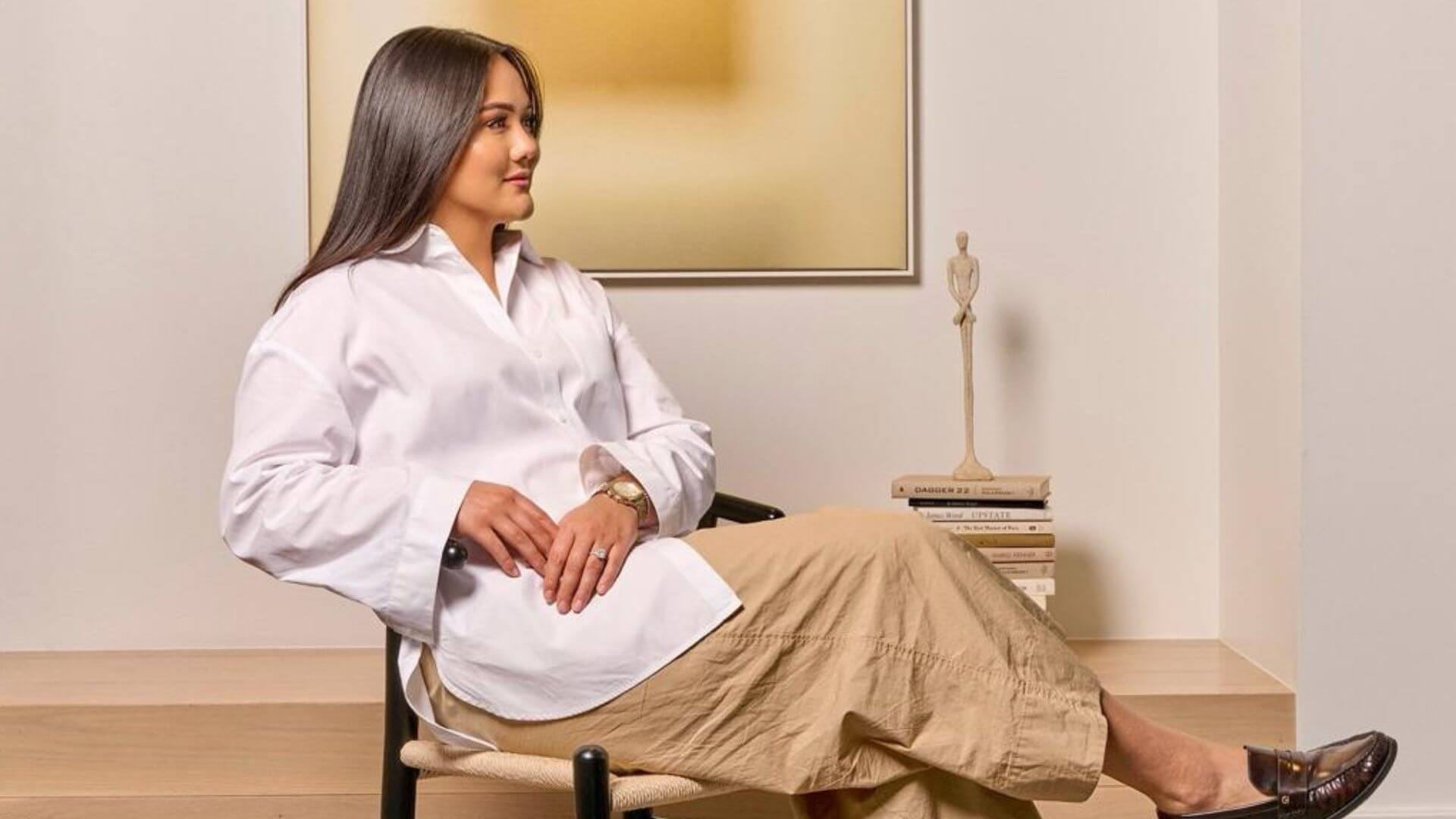 Veronica Ume-Ezeoke (M.B.A. ’17) sits in a chair.