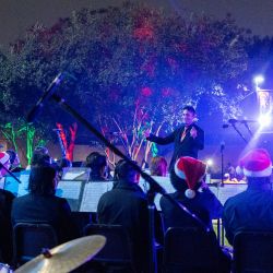 Matt Mireles leads musicians at the Christmas Tree Lighting 2024.