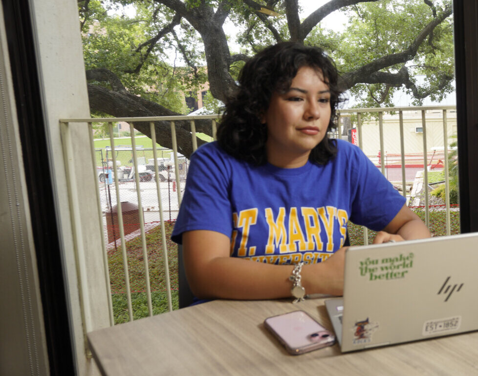 Female student works on her laptop.