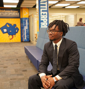 Nnamdi “Jesse” Onwuzurike takes a seat inside the Charles L. Cotrell Learing Commons.