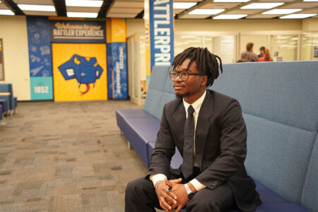 Nnamdi “Jesse” Onwuzurike takes a seat inside the Charles L. Cotrell Learing Commons.