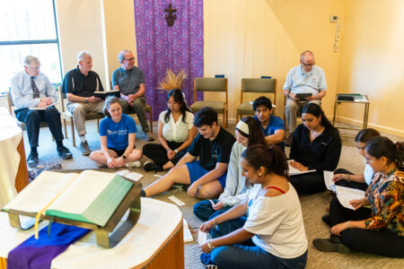 Students and Marianists pray at Casa Maria.