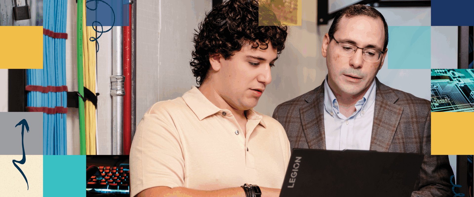 Ayad Barsoum, Ph.D., and Juan Marco Saca Dada review an AI prompt on a labtop.