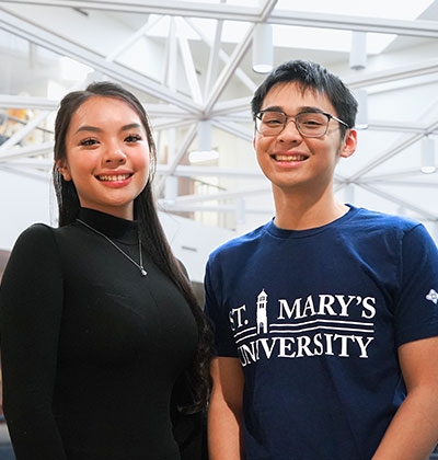 Nguyen Phuong Thao “Katie” Pham, left, and Tri Ma are two students from Vietnam who have taken different paths to get to St. Mary’s University's Greehey School of Business.