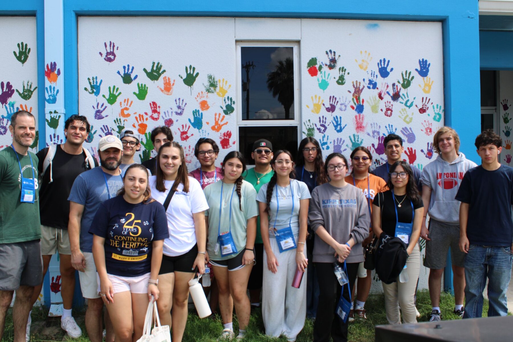 Students in the Wayfinders Program take a group photo together after helping out at the food pantry.