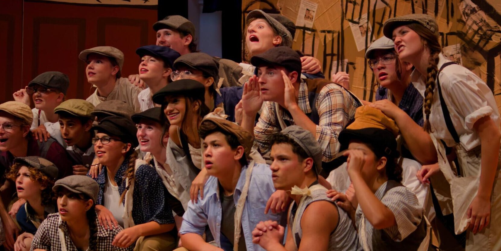 A group of theatre students perform together on the sage during camp.