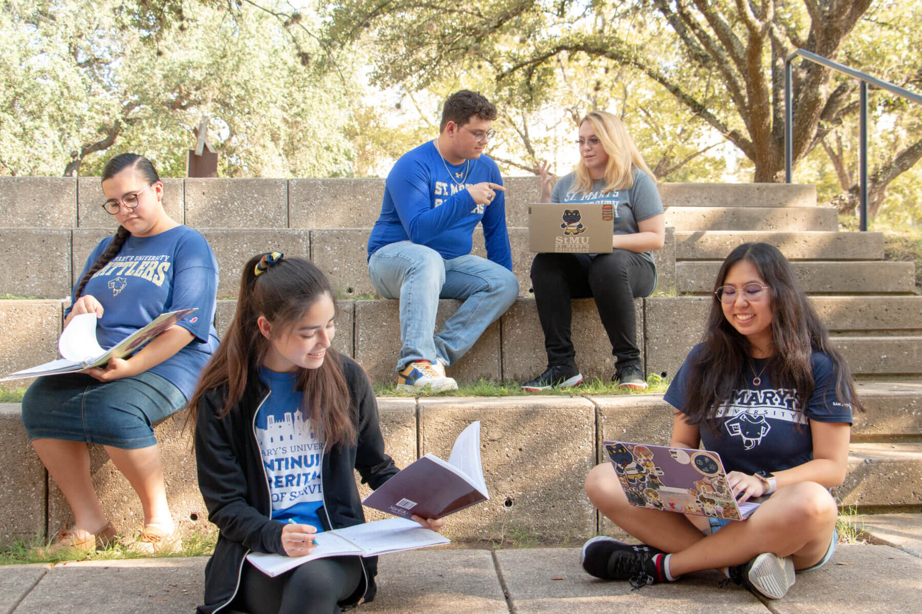 Students study and relax outside at the St. Mary's University amphitheater.
