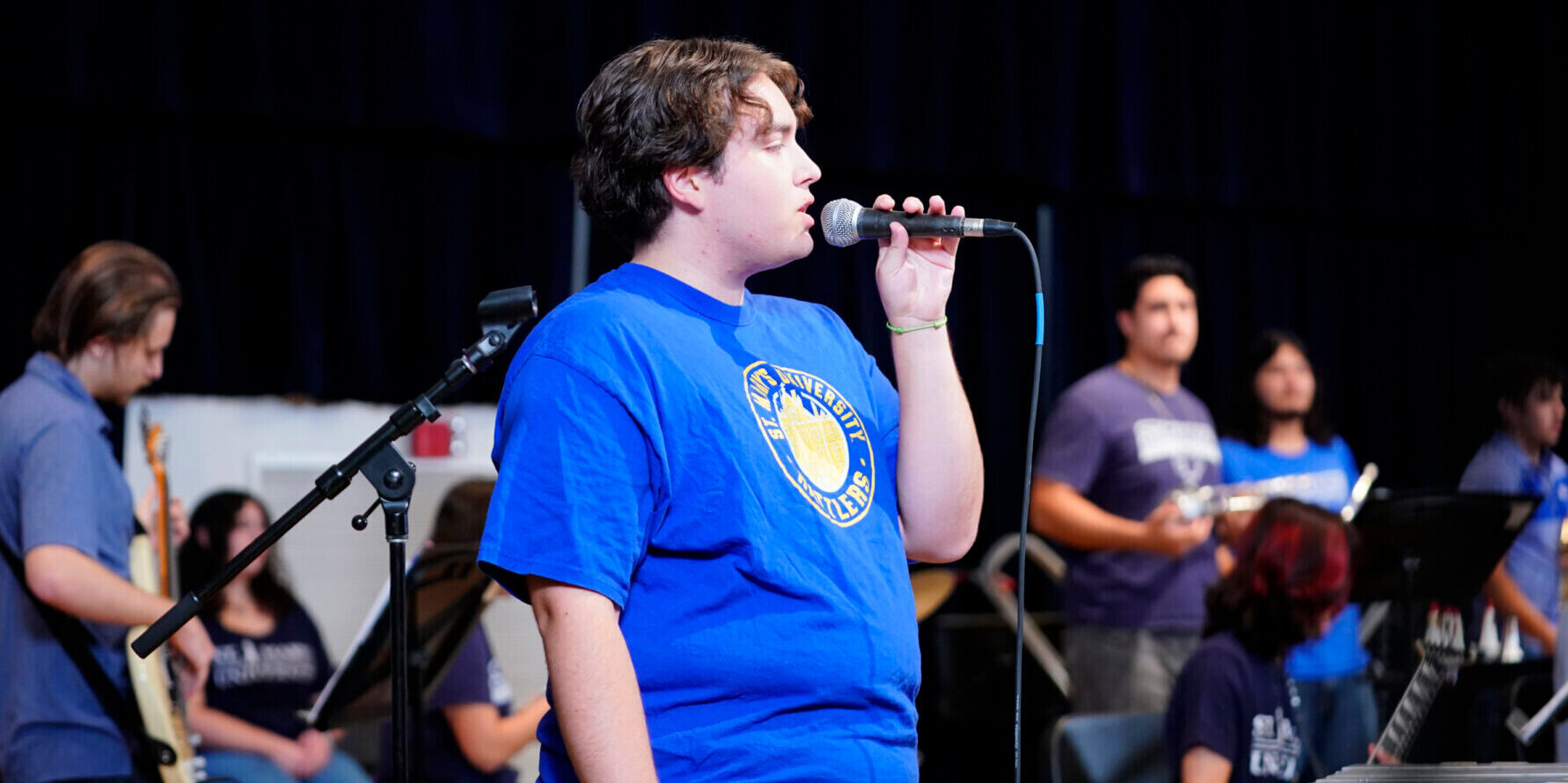 A male student practices singing.