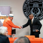 UTRGV President Guy Bailey, left, shakes the hand of St. Mary's President Winston Erevelles at the MOU signing for the Rio Grande Valley Legal Hub.
