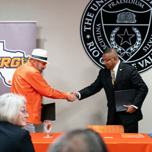 UTRGV President Guy Bailey, left, shakes the hand of St. Mary's President Winston Erevelles at the MOU signing for the Rio Grande Valley Legal Hub.
