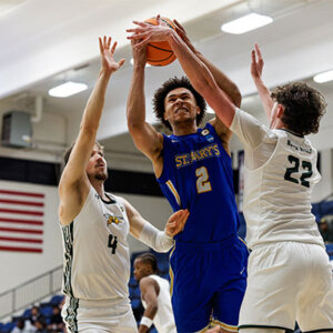 Eddie McPhee (2) drives to the basket during Sunday's game.