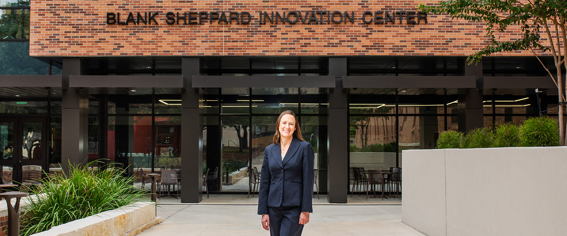 Jennifer LaFoy stands in front of the Blank Sheppard Innovation Center.