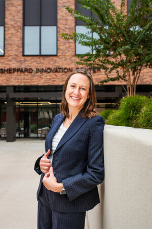 Jennifer LaFoy stands in front of the Blank Sheppard Innovation Center.