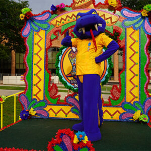 Rattler Man stands on float at Fiesta Oyster Bake 2025.