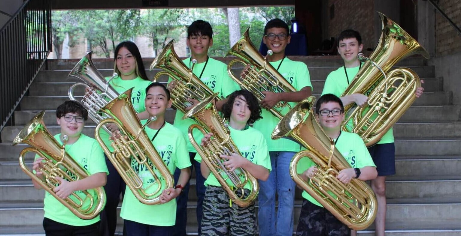 Summer band camp horns section take a group photo.