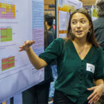 A student displays her poster during the annual St. Mary's University Research Showcase