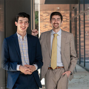Roland “RJ” Rojas, left ,and Maroun Harb (B.B.A./B.S. ’23), stand outside the Blank Sheppard Innovation Center on campus.