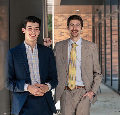 Roland “RJ” Rojas, left ,and Maroun Harb (B.B.A./B.S. ’23), stand outside the Blank Sheppard Innovation Center on campus.