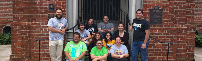 Alternative Spring break students take a group photo at the Rayne Memorial Methodist Episcopal Church South 1875