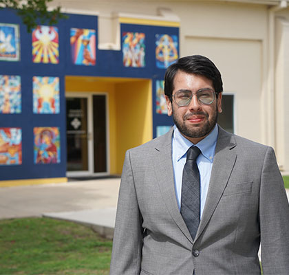 Eduardo Velazco stands outside the University Ministry building.