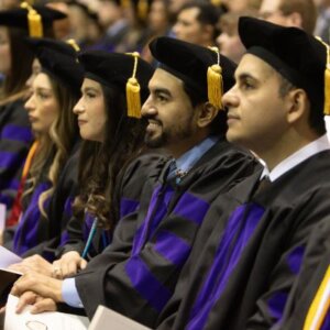 J.D. graduates are dressed in full commencement regalia at the Spring Commencement.