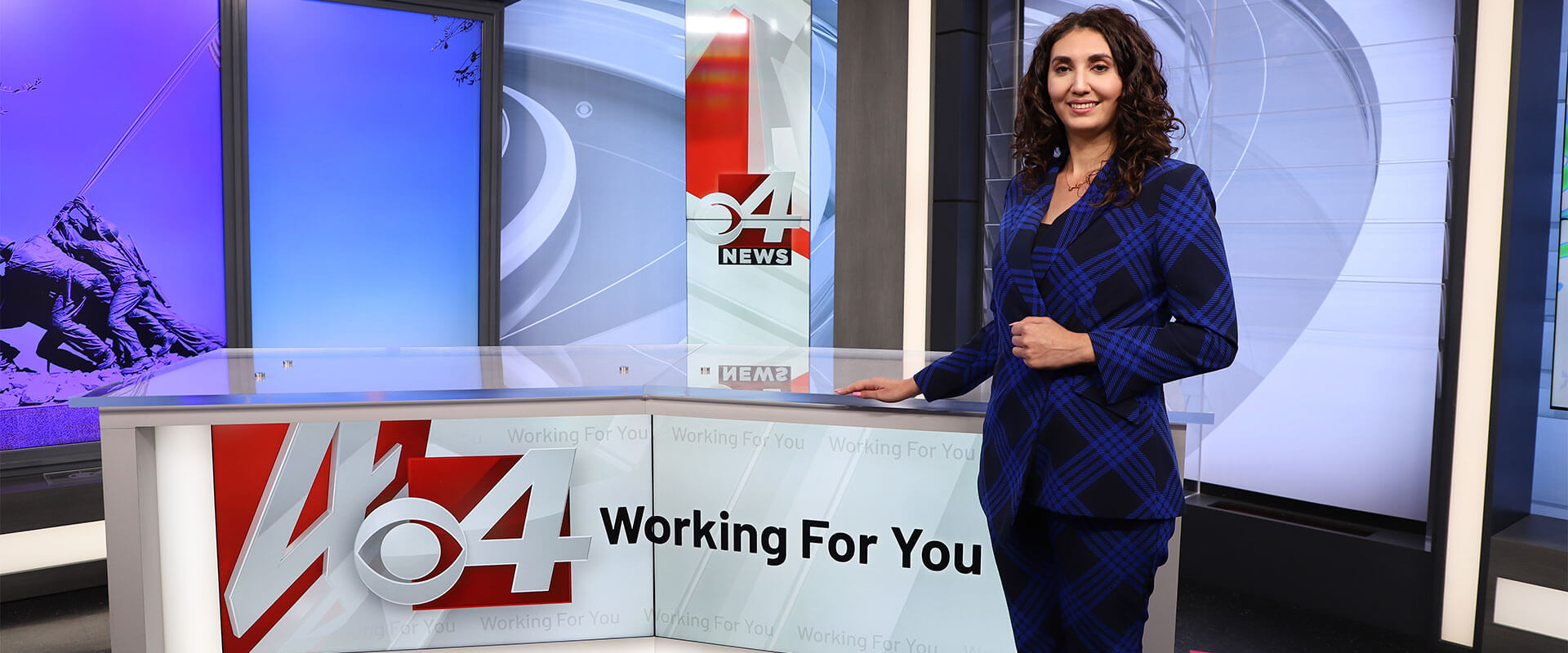 Tawny Davis at the anchor desk for KVEO TV in the Rio Grande Valley.