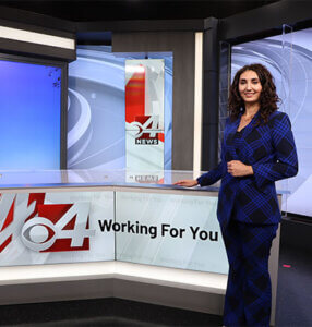 Tawny Davis at the anchor desk for KVEO TV in the Rio Grande Valley.