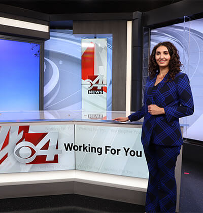 Tawny Davis at the anchor desk for KVEO TV in the Rio Grande Valley.