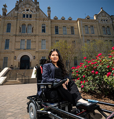 Political Science major Jado Cano outside St. Louis Hall on the St. Mary's University campus.
