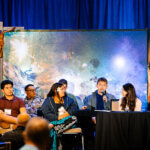 Stephen Garcia, with microphone, sits on a panel at the 2026 Province Assembly in Dayton, Ohio.
